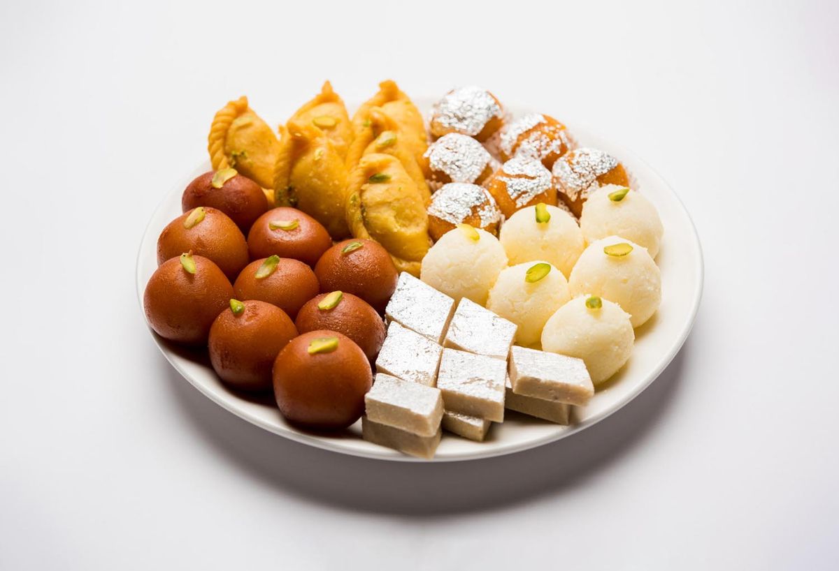 different types of sweets and mithai like gulab janum, ras malai, barfi, ladoo and more